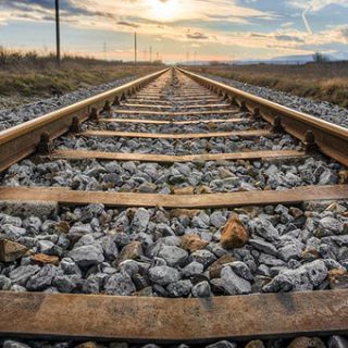 Railroad Tracks To Horizon